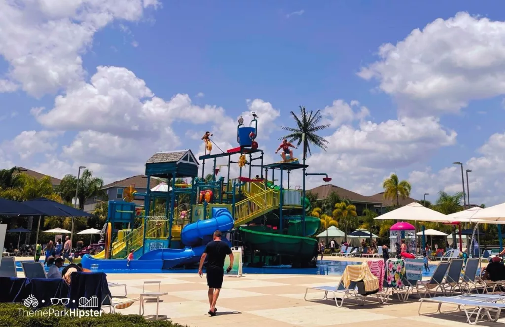 Waterpark area in Encore Resort with water slides, splash area and sun umbrellas all around with sun loungers. Keep reading to discover more about Encore Resort. 