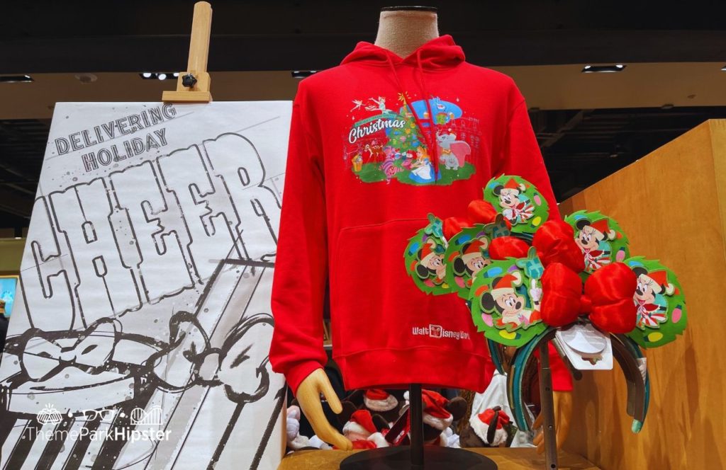 Disney Christmas Sweater and Minnie and Mickey Mouse Ears. Keep reading to know what to pack and wear to Disneyland in December with these fun winter outfit ideas.