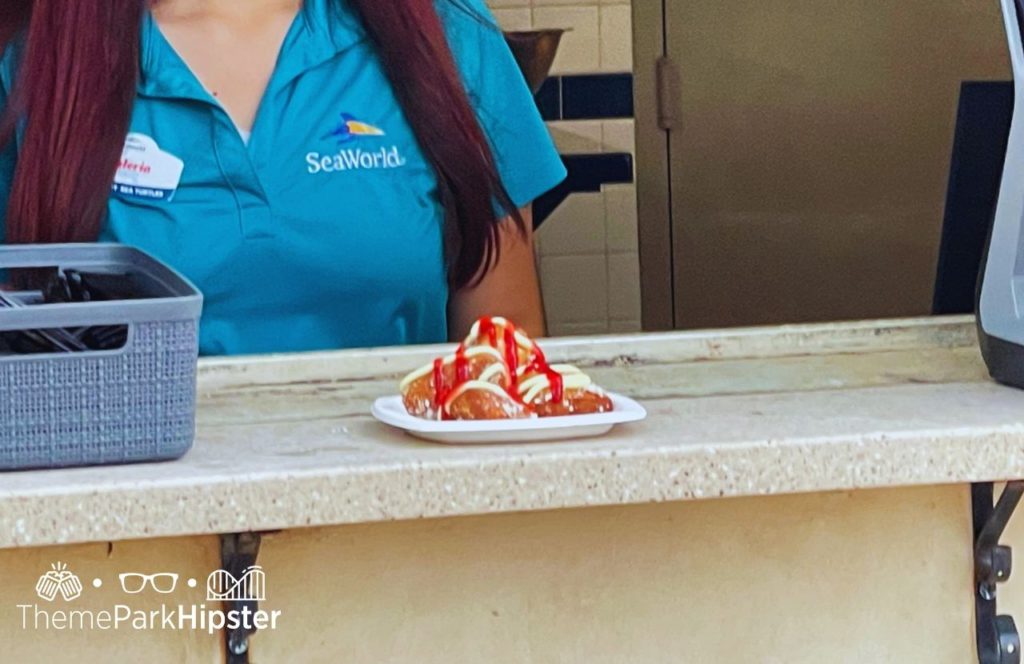 One of the best things to eat at SeaWorld Orlando Christmas Celebration Food Tis the Season Beignets Strawberries and Cream