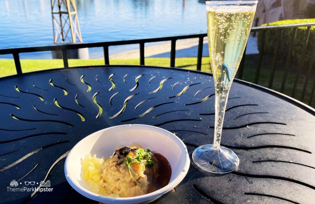 2024 Epcot Festival of the Arts Disney World Canada mushroom risotto and champagne. Keep reading to get the full Epcot Festival of the Arts Menu!