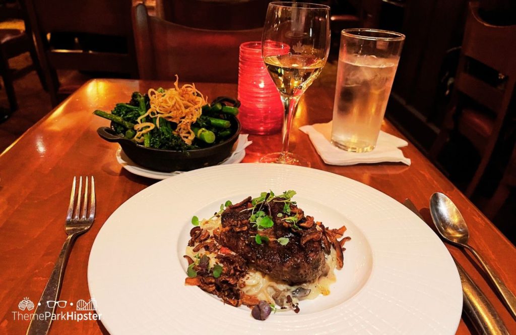 Epcot Theme Park Disney World Canada Pavilion Le Cellier Steakhouse Filet Mignon with Broccoli. One of the best Disney World bucket list items to put on your to-do list.