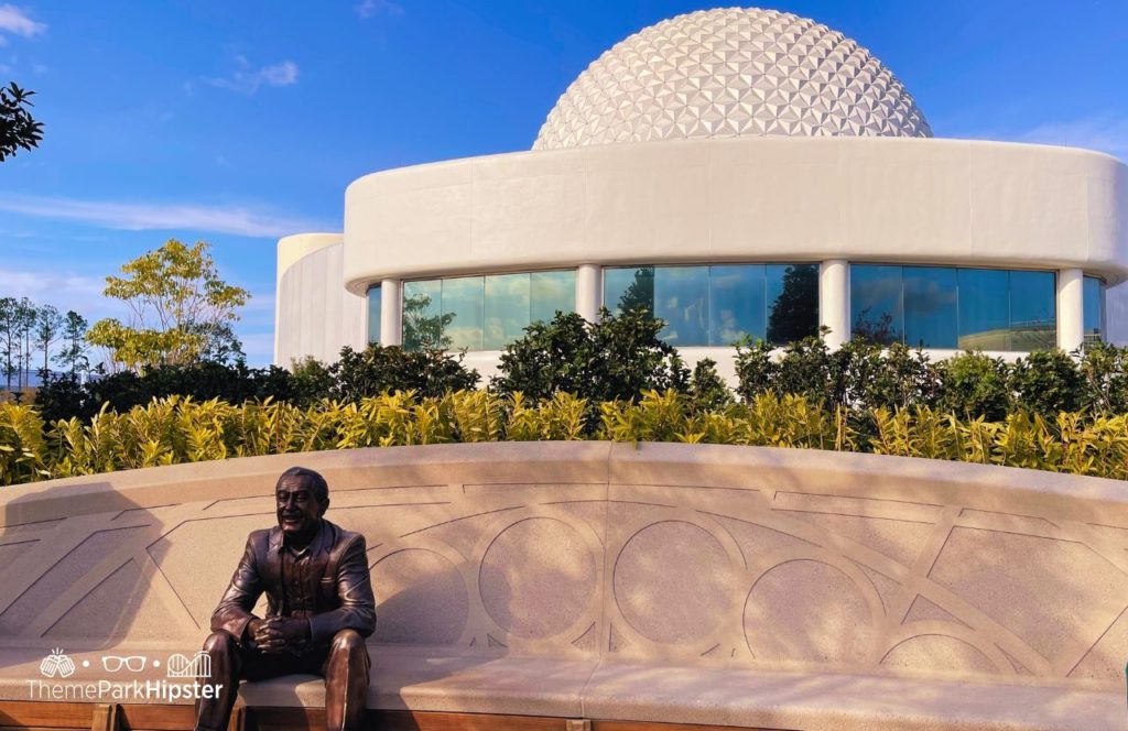 Epcot Theme Park Disney World Spaceship Earth with Walt Disney statue. Keep reading to get the full guide on the boat rides at Epcot.