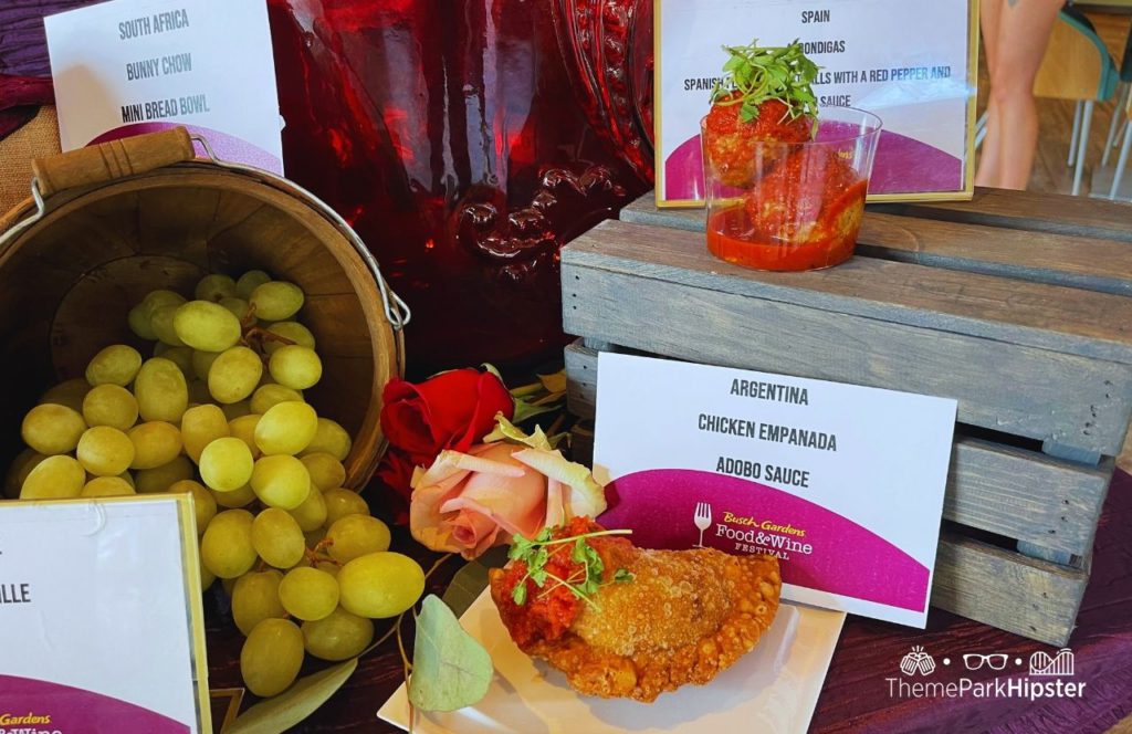 Busch Gardens Tampa 2024 Food and Wine Festival Chicken Empanada and Bondigas meatball. One of the best things to eat at Busch Gardens Food and Wine Festival.