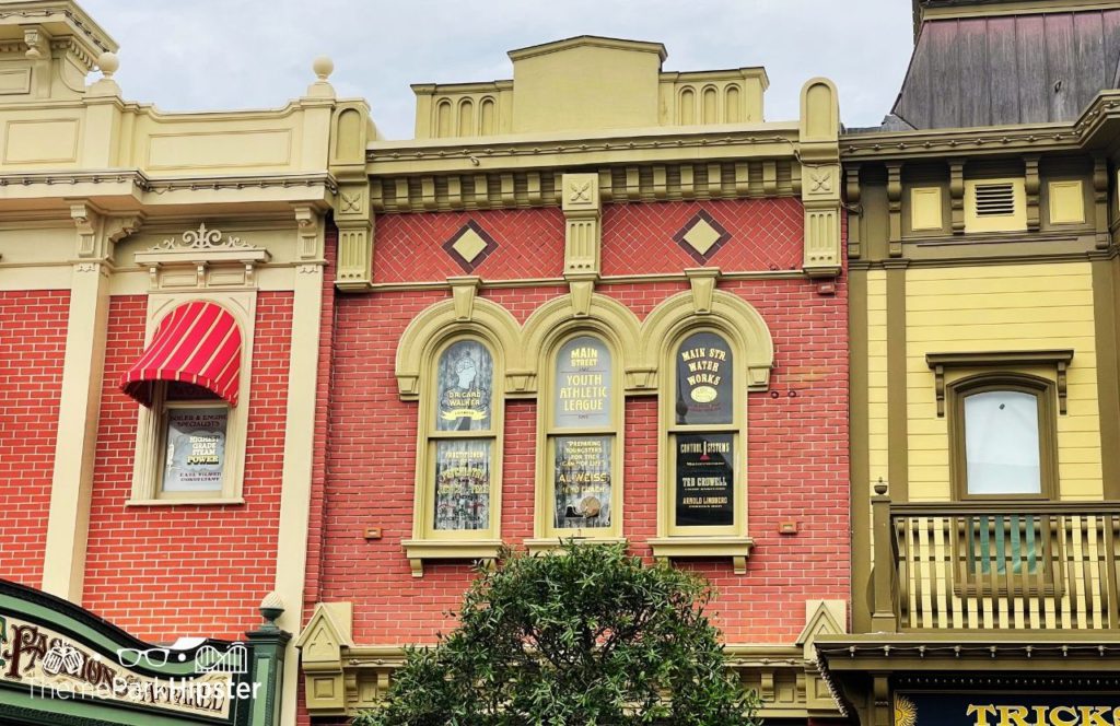 Disney Magic Kingdom Park Main Street USA windows. Keep reading to get the best Disney Magic Kingdom secrets and fun facts.