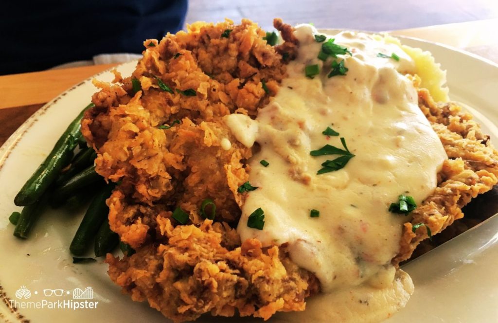 Walt Disney World Disney Springs Chef Art Smith's Homecomin Restaurant Chicken Fried Steak with green beans and gravy