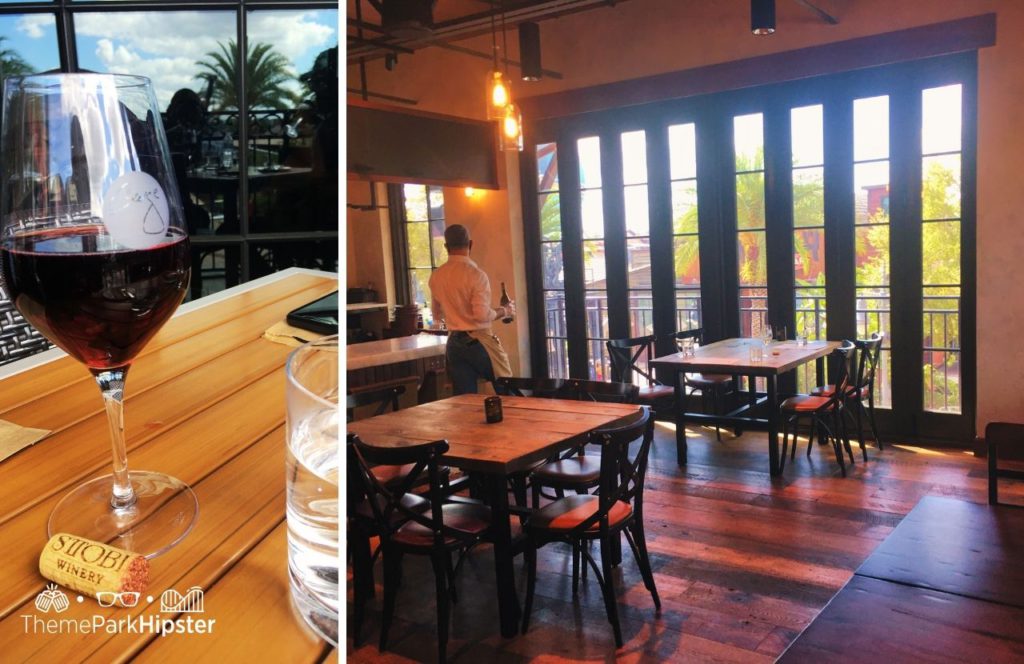 Walt Disney World Disney Springs Wine Bar George Restaurant interior with rustic vibes and a glass of wine on the table while outdoor dining. Keep reading to find out more about the best restaurant at Disney Springs Wine Bar George.