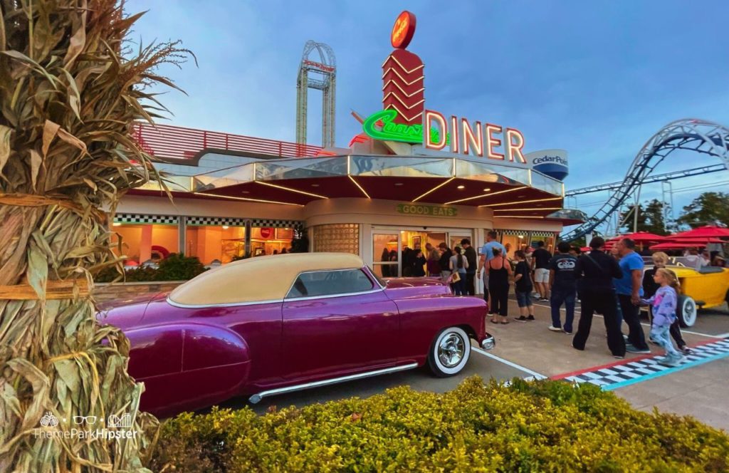 Cedar Point Amusement Park Ohio Coaster Diner Restaurant with Power Tower and Corkscrew Roller Coaster. Keep reading for more Cedar Point Solo Travel Tips!