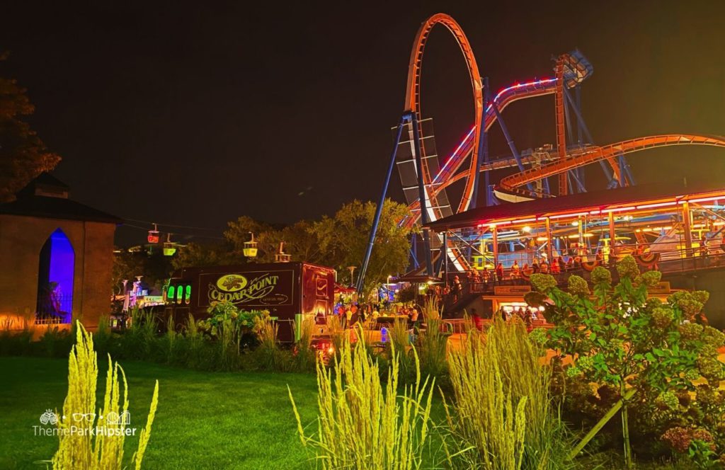 Cedar Point Amusement Park Ohio Valravn roller coaster at night and food truck