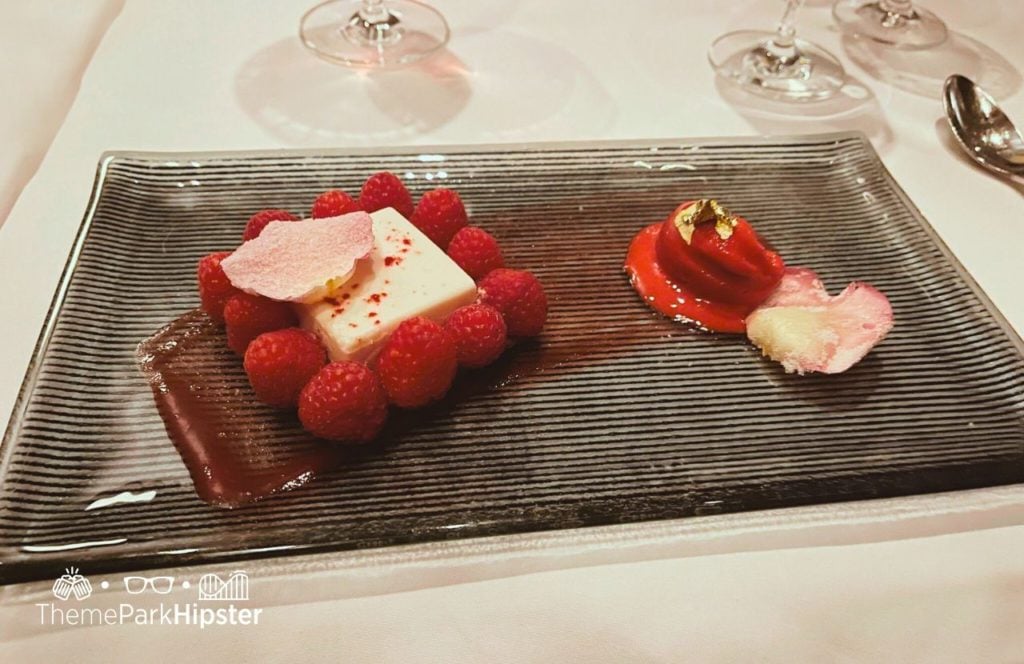 Raspberry dessert Bull and Bear Steakhouse Restaurant Orlando Waldorf Astoria at Disney World. Keep reading to find out all you need to know about eating at Bull & Bear Waldorf Astoria Orlando.