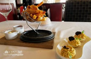 Steak fries and deviled eggs Bull and Bear Steakhouse Orlando at Waldorf Astoria Hotel Bonnet Creek Hilton Signia Hotel at Disney World