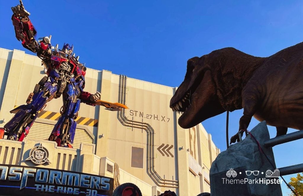 TRex from Jurassic World and Park at Universal Mega Movie Parade. One of the best things to do at Universal Studios Orlando Florida. Keep reading to find out if Lombard's Seafood Grille at Universal Studios is worth the visit.  