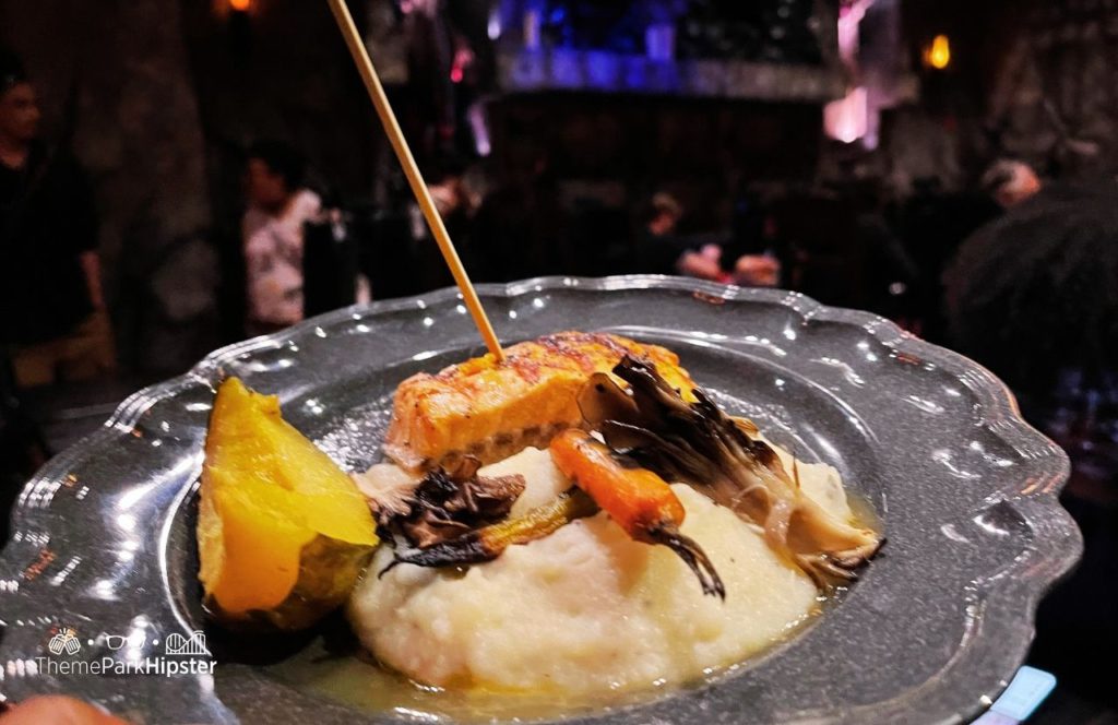 Dark Universe Das Stakehaus Restaurant Fish on a Stake with Mashed Potatoes Universal Epic Universe Theme Park Orlando