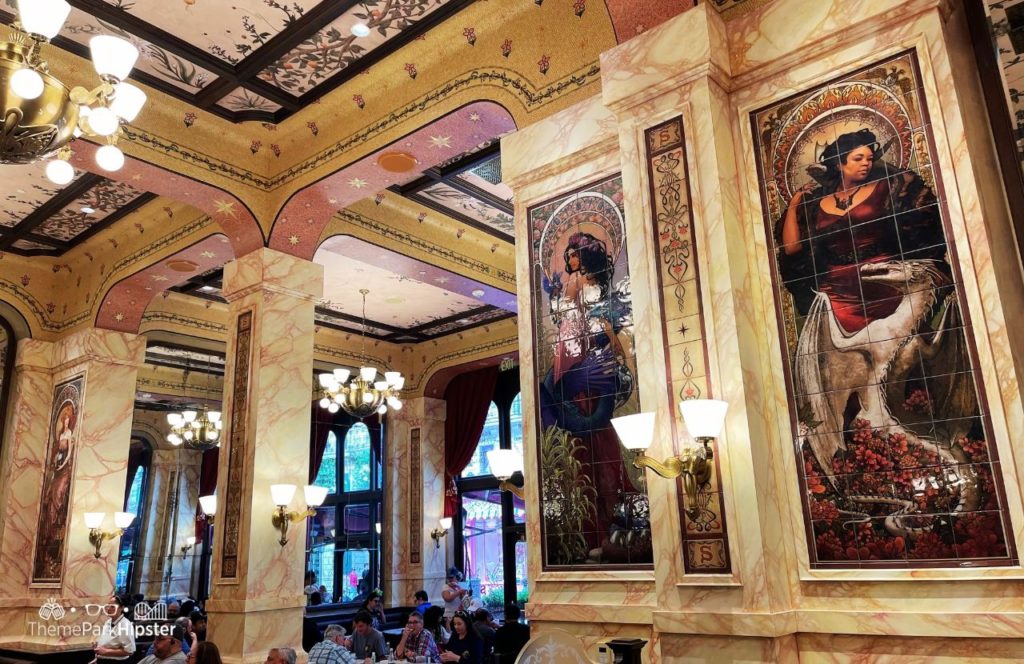 The Wizarding World of Harry Potter Ministry of Magic Café L’air De La Sirène Universal Epic Universe Theme Park Orlando. Keep reading for your full guide to Universal Epic Universe.