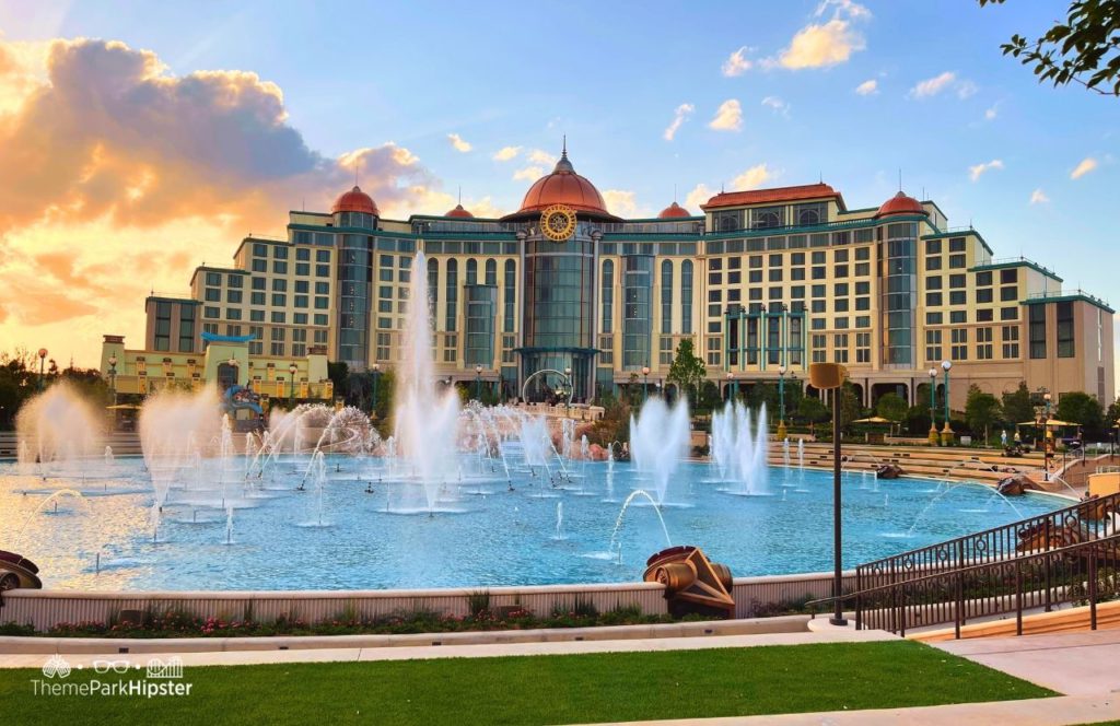 Water Fountains on the Cosmic Lagoon with Helios Hotel in the Background Universal Epic Universe Theme Park Orlando