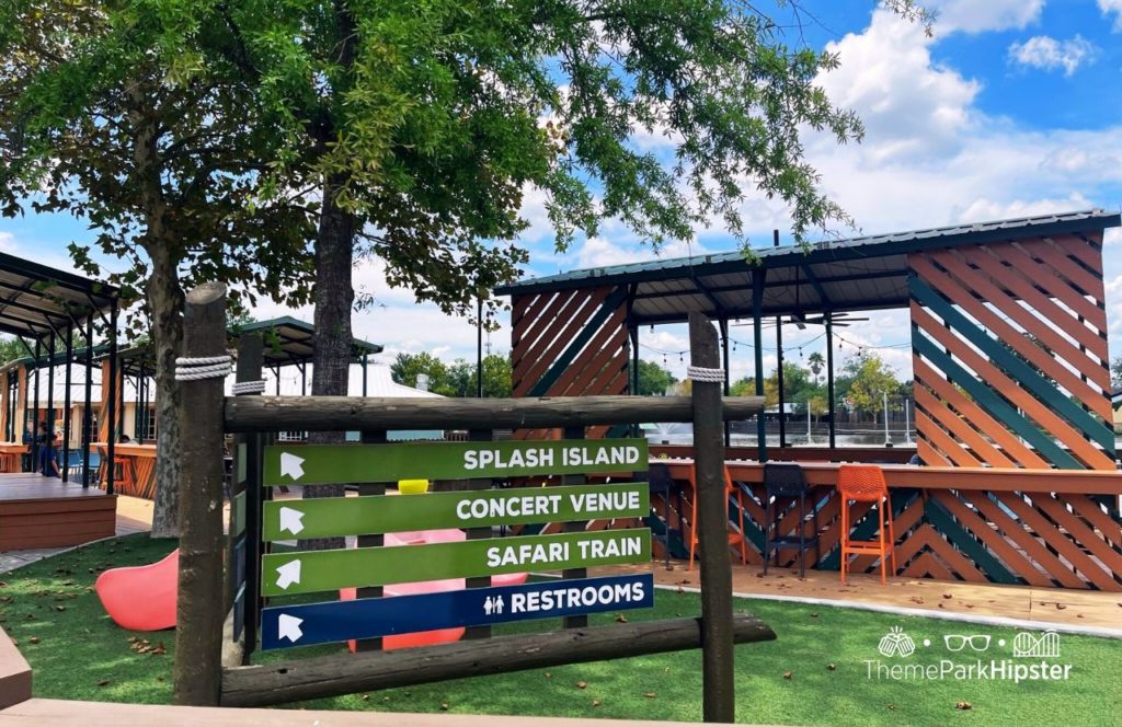 Wild Adventures Theme Park in Valdosta, Georgia Water's Edge Boardwalk Sign to Splash Island Concert Venue Safari Train. Keep reading to find out more about Wild Adventures theme park. 
