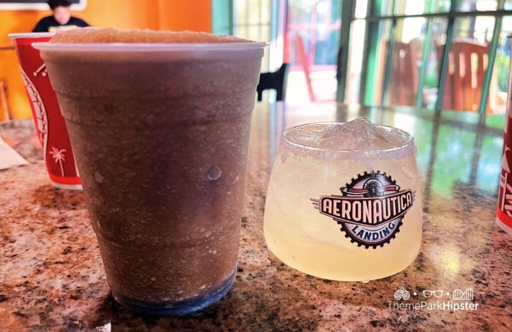 Carowinds Amusement Theme Park Harmony Hall Dining Restaurant Aeronautica Landing bar with margarita cocktail drink and Hennessy and coke frozen drink