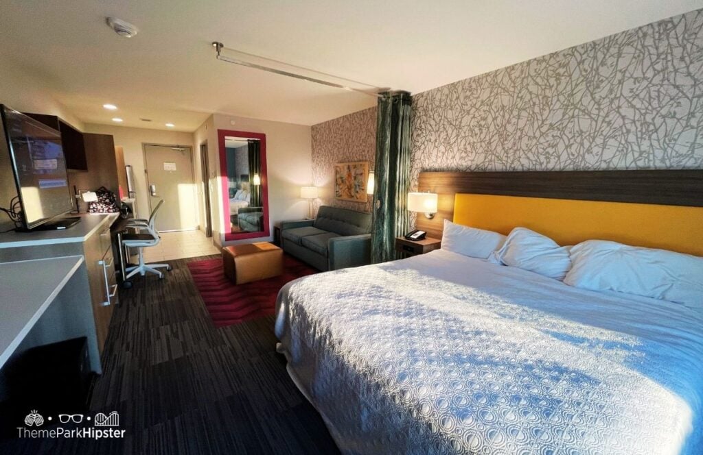 Suite Room bed and couch Tru by Hilton Hotel in San Antonio near Six Flags Fiesta Texas